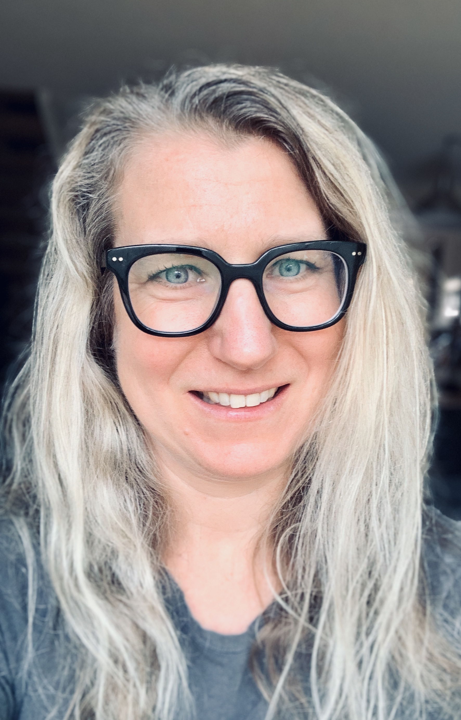 Woman with blonde hair smiling