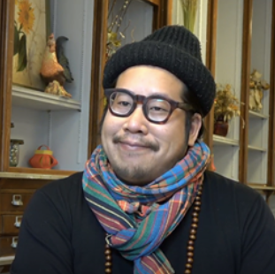 Detail from screenshot of interview of Hac Tran, from the Children of Refugees digital oral history exhibit.